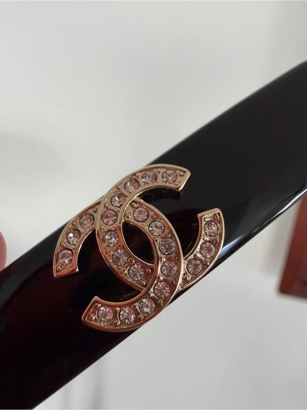 CHANEL Black Resin Hair Clip with Gold Crystal CC Logo